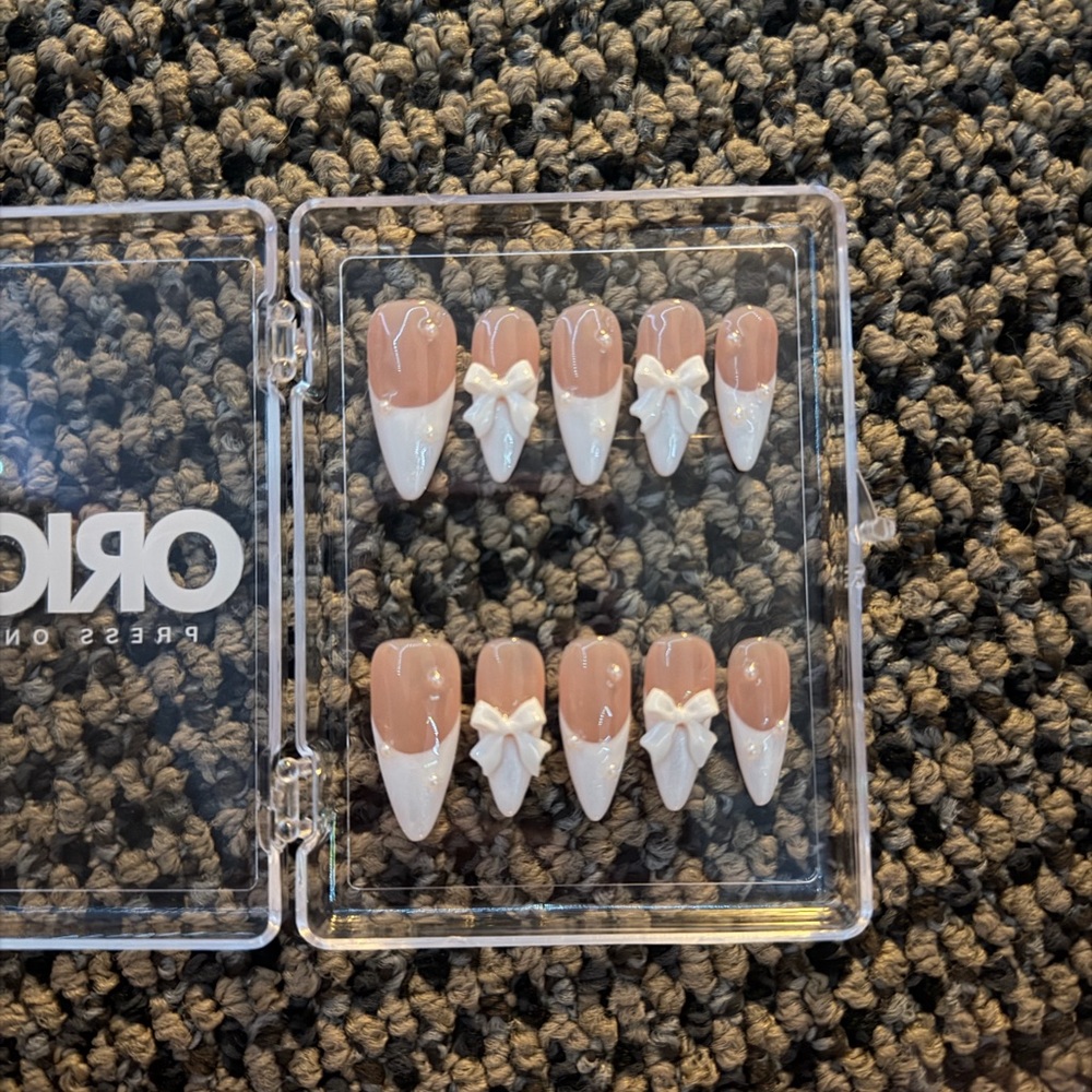Elegant Nude and White Press-On Nails with Bow Design